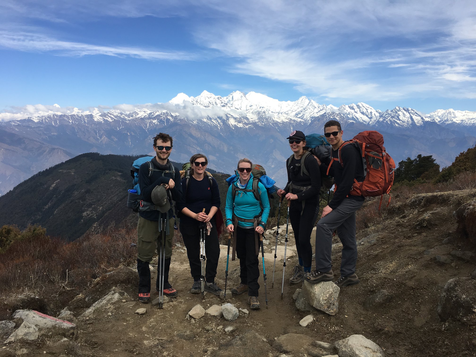 Trekker overlooking the sacred Gosainkunda Lake surrounded by snow-capped peaks during the Langtang Gosainkunda Lake Trek in Nepal