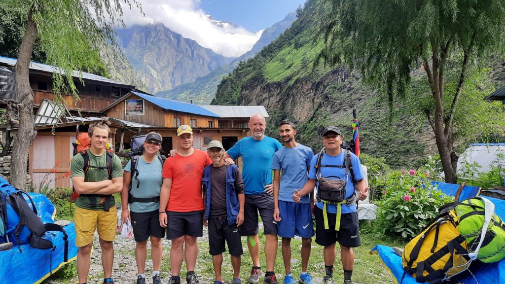 A group of trekkers standing together on the Manaslu Trek, surrounded by breathtaking mountain landscapes.
