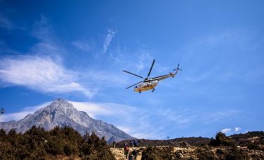 Helicopter flying above Mount Everest and Khumbu Glacier with panoramic views of Lhotse, Ama Dablam, and Nuptse during the Everest Heli Tour in Nepal.