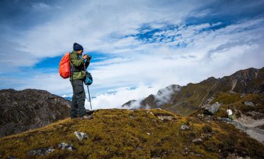 Traditional shamans performing spiritual rituals near the sacred Gosainkunda Lake in Nepal, surrounded by Himalayan peaks during the Gosainkunda Shamanism Culture Trek.