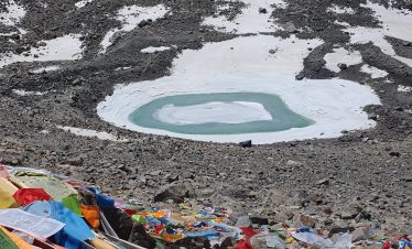 Aerial view of Mount Kailash, Lake Manasarovar, and the Himalayan landscape during the Kailash Manasarover Yatra by Helicopter to Hilsa in Tibet.