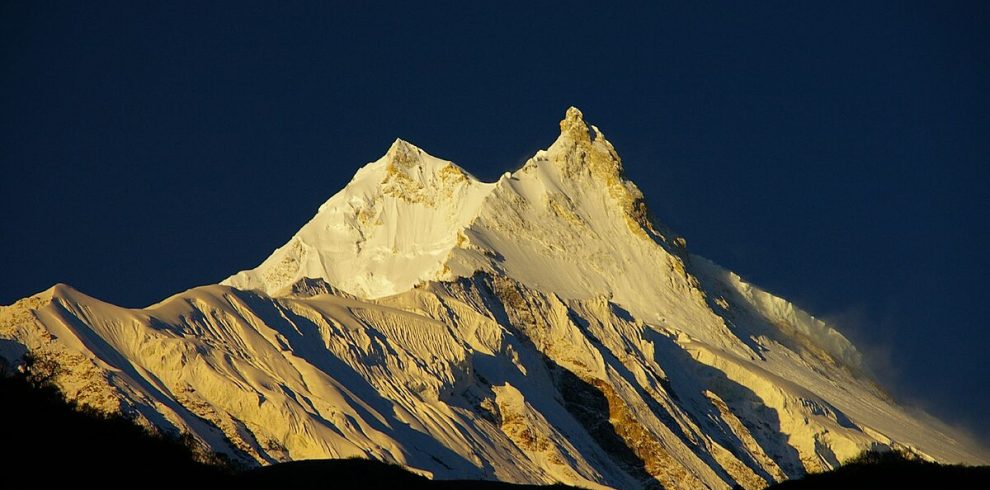 Climbers ascending the snowy slopes of Mount Manaslu, the eighth-highest mountain in the world, during the Manaslu Expedition in Nepal.”