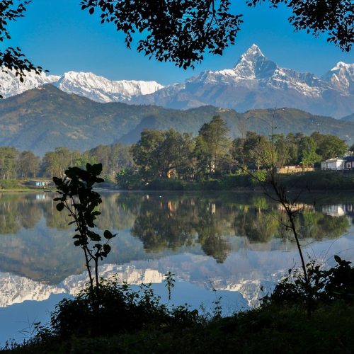 Breathtaking view of Machhapuchhare reflecting in Phewa Lake, Nepal.