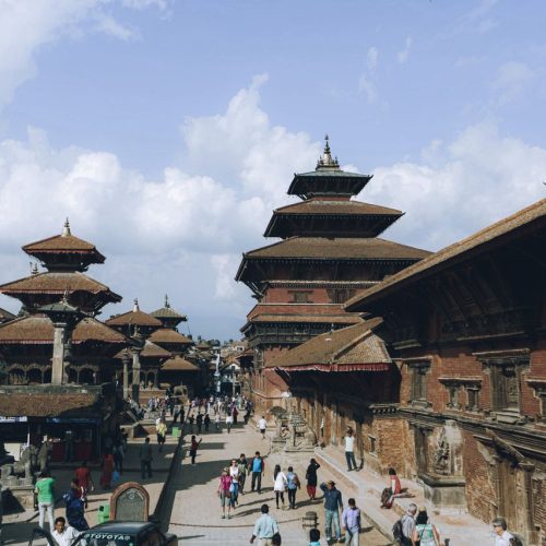 Lively scene at Patan Durbar Square showcasing Newar architecture and cultural heritage.