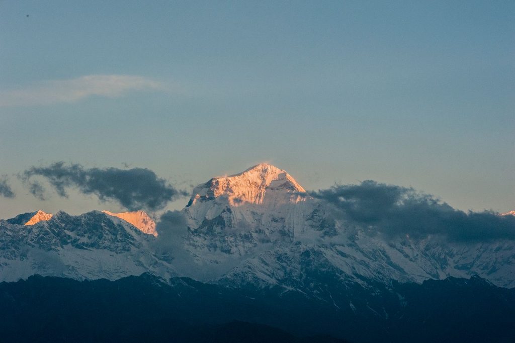 Sunrise over the snow-capped Dhaulagiri mountain in Nepal, capturing nature's serene beauty.